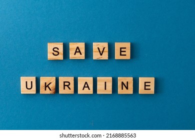 Save Ukraine background. Phrase from wooden letters. Top view words. The phrases is laid out in wood letter. Motivation.