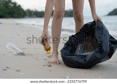 Save water. Volunteer pick up trash garbage at the beach and plastic bottles are difficult decompose prevent harm aquatic life. Earth, Environment, Greening planet, reduce global warming, Save world
