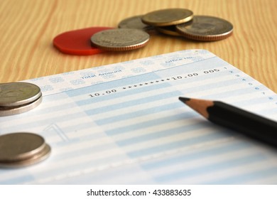 Saving account from bank with coins and pencil on the table for financial and loan - Shutterstock ID 433883635