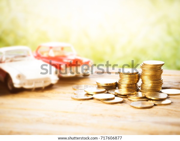 saving for car, stack of\
money, rows of coins for finance and banking concept, money growing\
concept