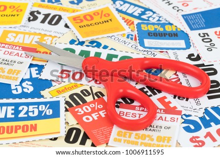 Saving discount coupon voucher with scissor, coupons are mock-up
