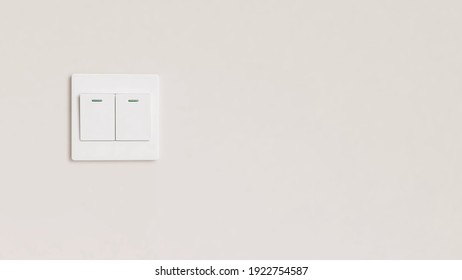Saving energy concept - Beautiful clean wall inside the room with a white light power switch.  Environmental, Turn off light, Sustainable living, Home, Copy space.