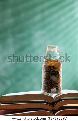 saving jar with coin for eduction