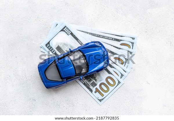 Saving money
to buy a car. Toy car with money
cash