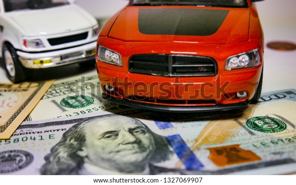 Saving money for car\
or trade car for cash. money from car loans. finance concept.\
Buying a car / Trade deal.\
