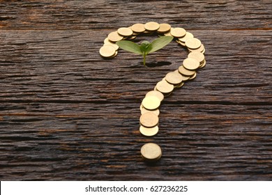 Saving Money Concept And Money Coin Shape Question Mark With Tree Growing For Business 