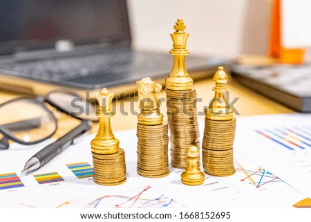 Saving money as a concept. Vintage retro stack of gold coins on the wooden background to represent It's time to do investing for retirement planning.