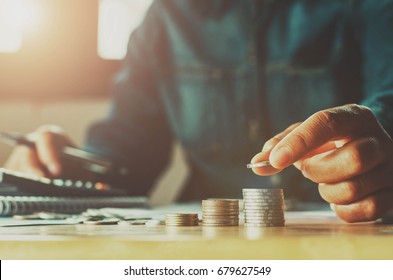 Saving money woman hand putting coin stack concept business finance