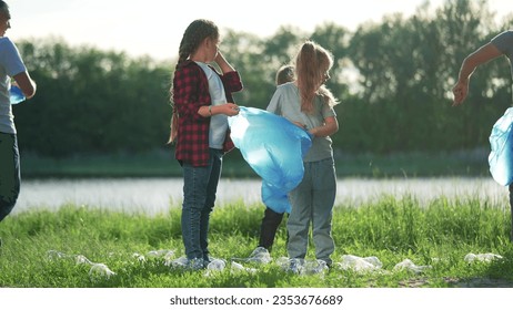 saving nature garbage collection. a group of volunteers save environment from threat of plastic pollution. volunteering, helping nature. clearing forest of plastic bottles scattered by people sun - Powered by Shutterstock