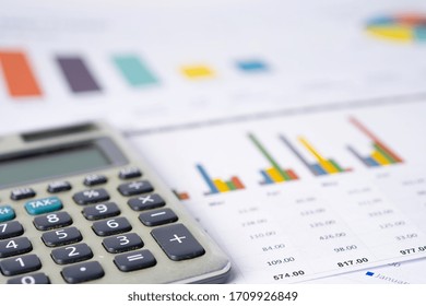 Saving Stack Coins Money, Calculator, Charts And Graphs Spreadsheet Paper. Finance, Account, Statistics, Analytic Research Data And Business Company Meeting Concept