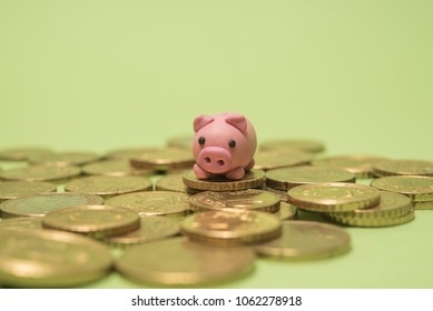 Savings Concept. Micro Piggy Bank On Top Of Coins. Money Concept.  Saving For Vacation. Home Finance Concept.