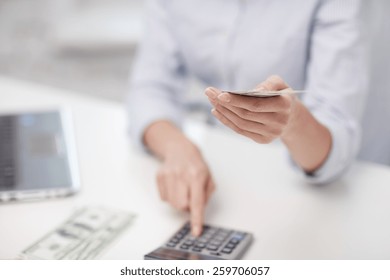 Savings, Finances, Economy, Technology And People Concept - Close Up Of Woman Counting Money With Calculator