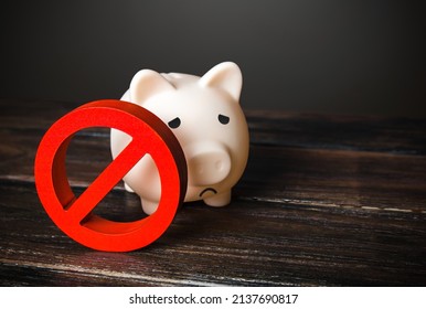 Savings frozen. Pig piggy bank under arrest. Sanctions, economic trading embargo. Sanctions restrictions. Freezing of assets, confiscation of property. Prohibition on investment and capital movement - Shutterstock ID 2137690817
