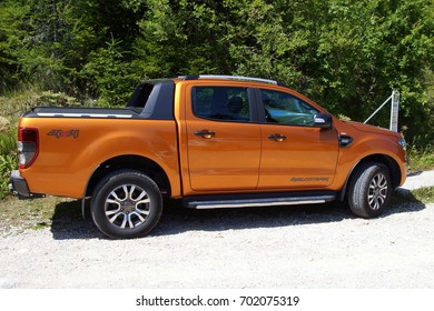 Savinjska, Slovenia - August 4, 2017: Orange Ford Ranger (codenamed T6) Wildtrack Parked By The Side Of The Road. Nobody In The Vehicle.