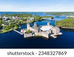 Savonlinna city in Finland with its iconic castle landmark seen from the air on a beautiful summer day