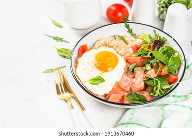 Savory Breakfast At White. Oatmeal Porrige With Salted Salmon, Egg And Fresh Salad.