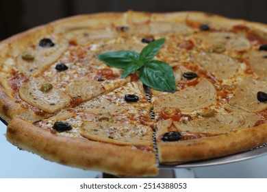 A savory chicken pepperoni pizza is topped with juicy slices of pepperoni, black olives, and fresh basil. The crispy crust and melted cheese create a deliciously satisfying bite. - Powered by Shutterstock