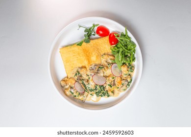 Savory crepe with creamy mushroom sauce, fresh greens on a white plate. Perfect for a light and satisfying meal. - Powered by Shutterstock