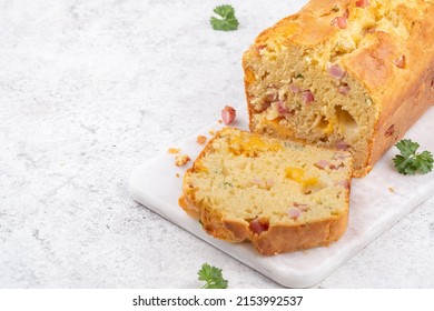 Savory ham and cheese loaf on cutting board - Shutterstock ID 2153992537