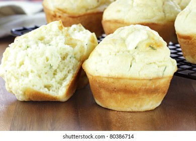 Savory muffins made with chives and feta cheese. Shallow depth of field with blur on lower portion of image. - Powered by Shutterstock