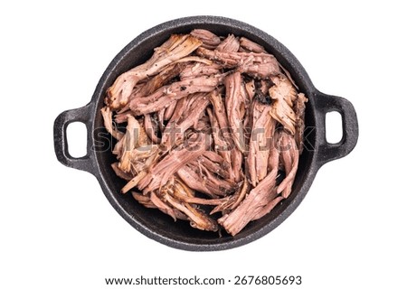 Savory pulled beef brisket served in a skillet, dipping  creating an appealing and mouthwatering culinary scene isolated on white background. top view.