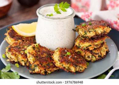Savory zucchini vegetable fritters with a sour cream dip