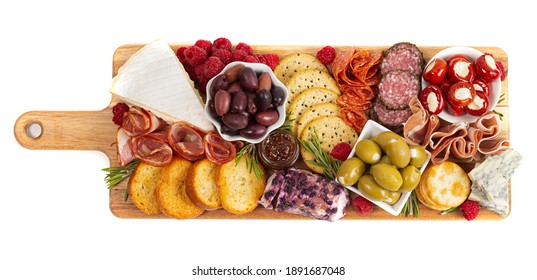 Savoury Charcuterie Board Covered in Meats Olives Peppers Berries and Cheese  - Powered by Shutterstock