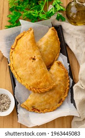 Savoury pastry Cornish pasty filled with chicken and potato - Shutterstock ID 1963445083