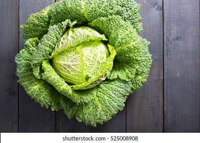 savoy cabbage from organic grower farm, on black wooden table