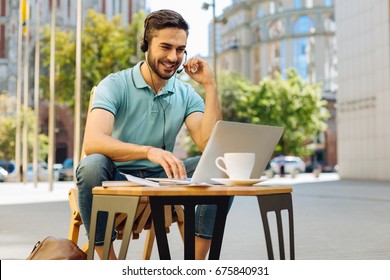 Savvy energetic guy calling someone online - Shutterstock ID 675840931