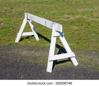 A Saw Horse Or Wooden Barrier To Control Traffic