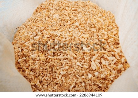 sawdust and shavings in bag. material for agriculture. mulch to cover the soil.