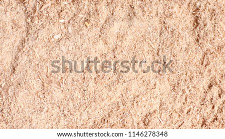 Sawdust or wood dust texture background. Wood sawdust background closeup. Sawdust floor texture. Top view. Saw dust texture, close-up background of brown sawdust. 