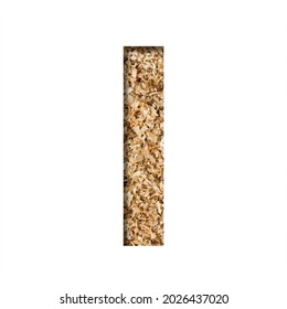 Sawdust Wood Font. The Letter I Cut Out Of Paper On The Background Of Sawdust Or Small Shavings Of A Fruit Tree. Decorative Alphabet For Handmade Or Small Production, Font Collection.