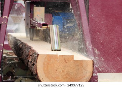 Sawing Boards From Logs With Modern Sawmill.