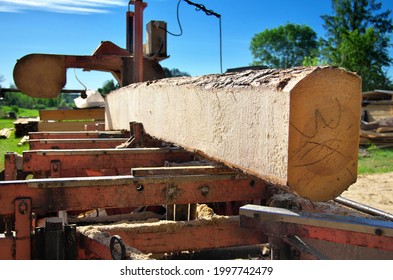 Sawing Logs On A Mobile Sawmill. Log On The Sawmill. Preparation For Cutting Wood.