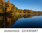 Sawmill Lake in High Point State Park, NJ, on a quiet and calm Autumn morning surrounded by brilliant fall foliage