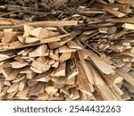 sawn wooden plank slab pile at sawmill storage, prepared for carpentry diy hobby or flooring. Woodshed store.Timber material stacked for woodworking. heap of wooden lumber planks