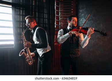 Sax Man And Fiddler Duet Playing Classical Melody