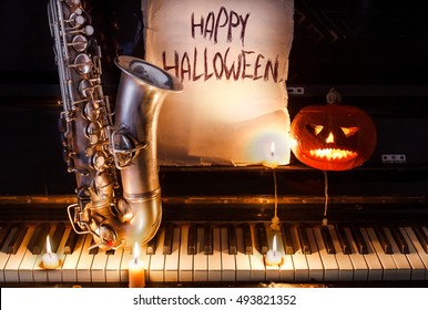 saxophone and Jack lantern on the piano