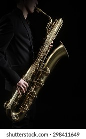 Saxophone Jazz Music Instrument Saxophonist With Baritone Sax Player Isolated On Black