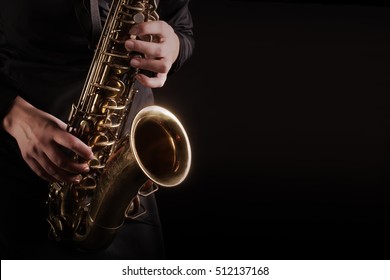 Saxophone Player hands Saxophonist playing jazz music. Alto sax musical instrument closeup - Shutterstock ID 512137168