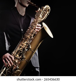 Saxophone Player Jazz Music Instrument Saxophonist With Baritone Sax Closeup On Black