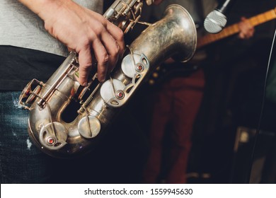 Saxophone Player Jazz Musician. Saxophonist With Baritone Sax Player.