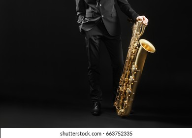 Saxophone Player Jazz Musician. Saxophonist With Baritone Sax Player