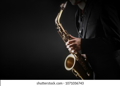Saxophone player. Saxophonist hands playing saxophone. Alto sax player with jazz music instrument closeup - Shutterstock ID 1071036743
