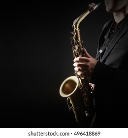 Saxophone Player Saxophonist playing jazz music with Sax alto - Shutterstock ID 496418869