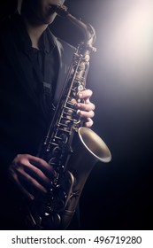 Saxophone Player Saxophonist Playing Jazz Music. Alto Sax Player With Musical Instrument