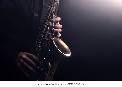 Saxophone player Saxophonist playing jazz music instrument Jazz musician playing sax alto - Shutterstock ID 600775652