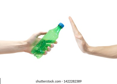 Say no plastic bottle. Concept. Man says no to plastic bottle. No waste. Environment. Hand gesture to reject proposal plastic bottle. Holds green bottle other hand don't want take it isolated on white